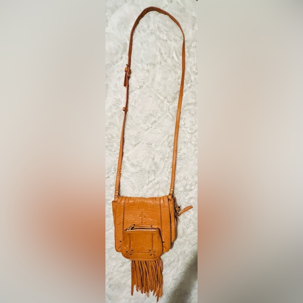 Jerome Dreyfuss Paris, a tan leather crossbody bag with fringing detail
